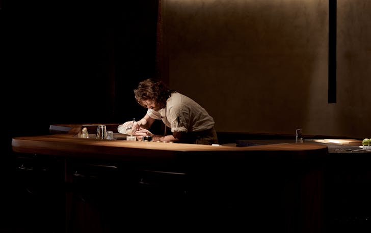 A person mixing a cocktail at one of Melbourne's best cocktail bars CBD. 