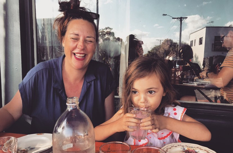 Renee is laughing whilst her daughter drinks water