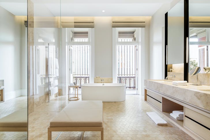 a light filled bathroom at COMO The Treasury with free standing tub