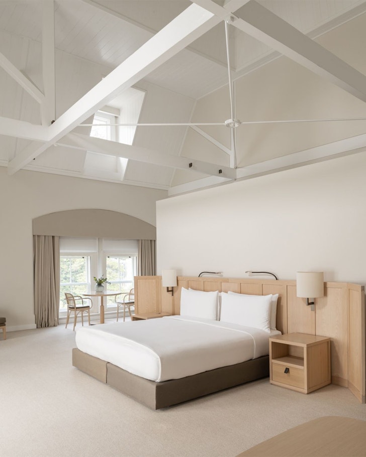 A high-ceilinged room in muted tones at COMO The Treasury one of the best hotels in Australia