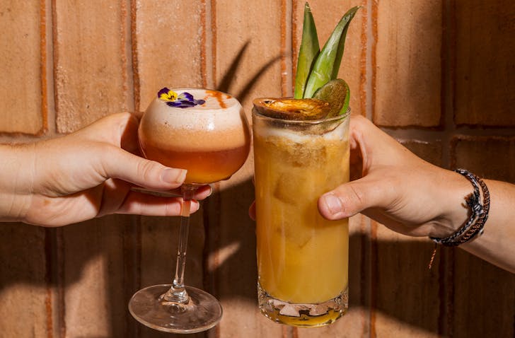 Two drinks clinking