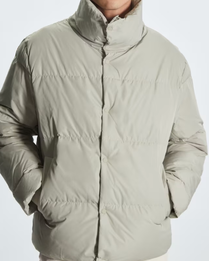  A light grey jacket, one of the best men's puffer jackets. 
