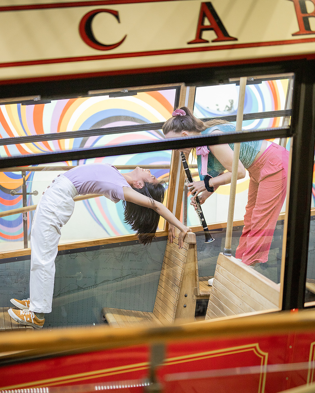 Two girls on the cable car duet.