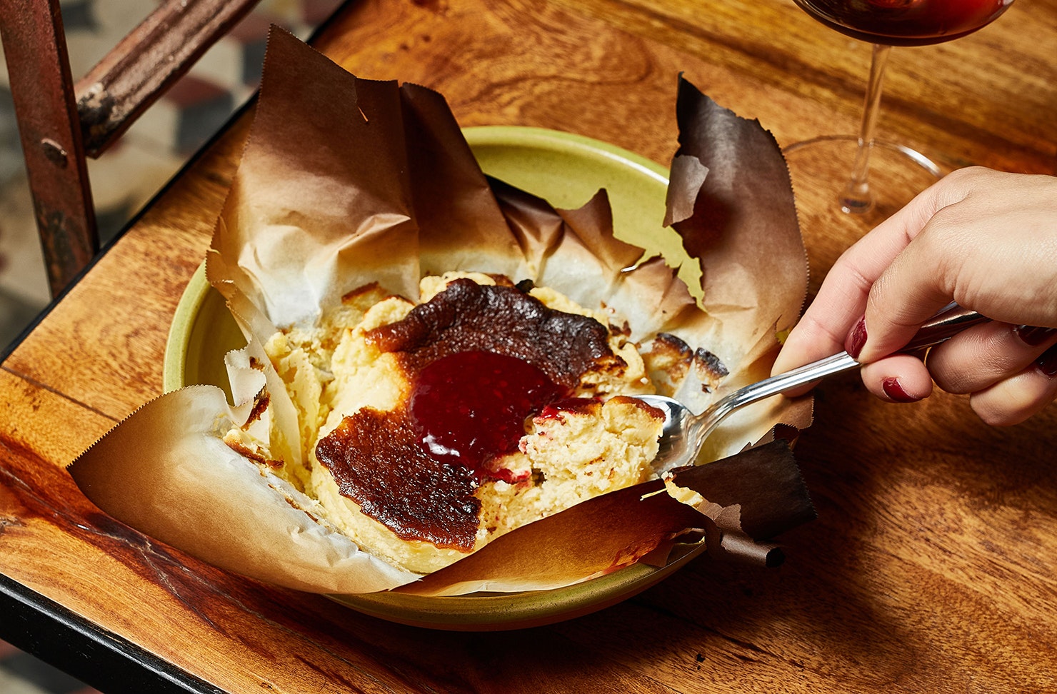 Someone digs into a basque cheesecake at Candela.