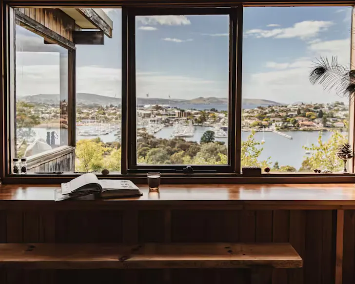 The view of the water from the breakfast bar at Canopy of Del Sol Treehouse one of the best Airbnbs in Hobart