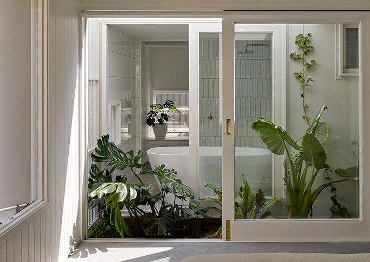 A shot of the open, light-filled bathroom of the Cantala Avenue House.