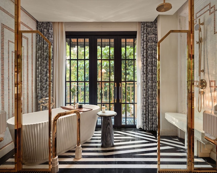 A luxurious bathroom at a room in Capella Hanoi one of the best Vietnam resorts