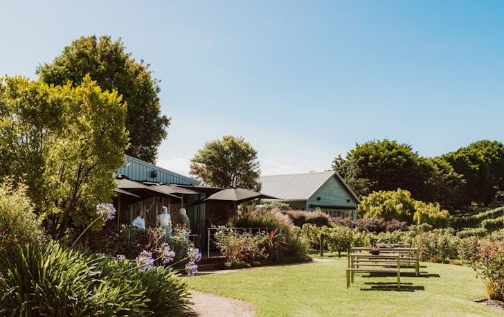 a large cellar door and house with blue skies, a best contender for the winery accommodation Victoria.