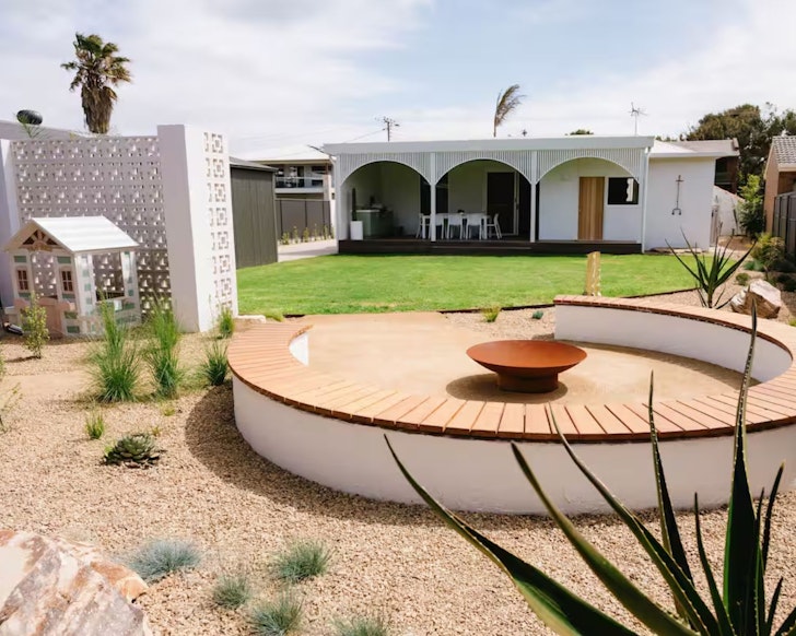 A view of the firepit and cubby house at Casa Billie one of the best kid-friendly Airbnbs in Australia
