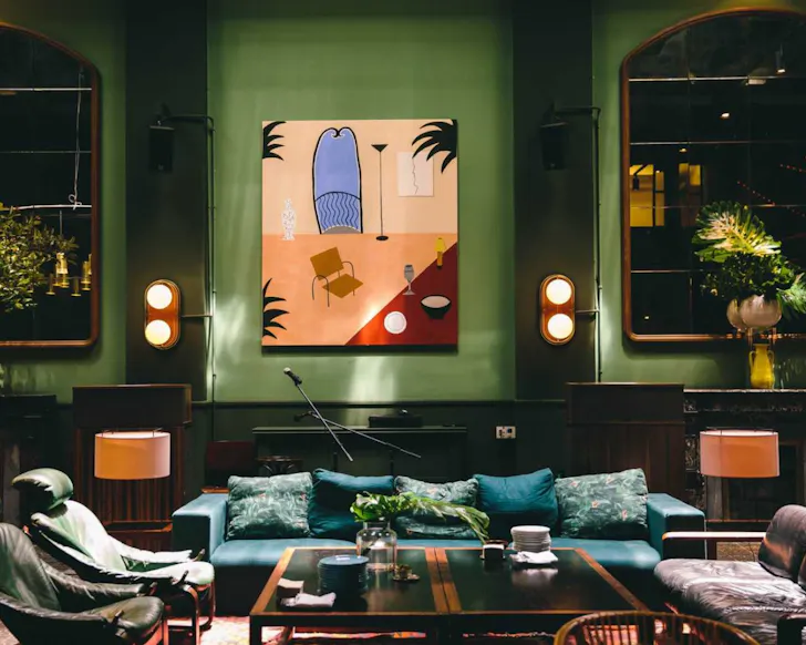 The beautiful, emerald green lounge area at Casa Bonay in Barcelona.