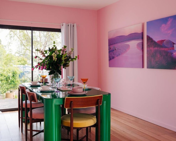 The green-legged dining table at Casa De Flex one of the best Airbnbs in Tasmania