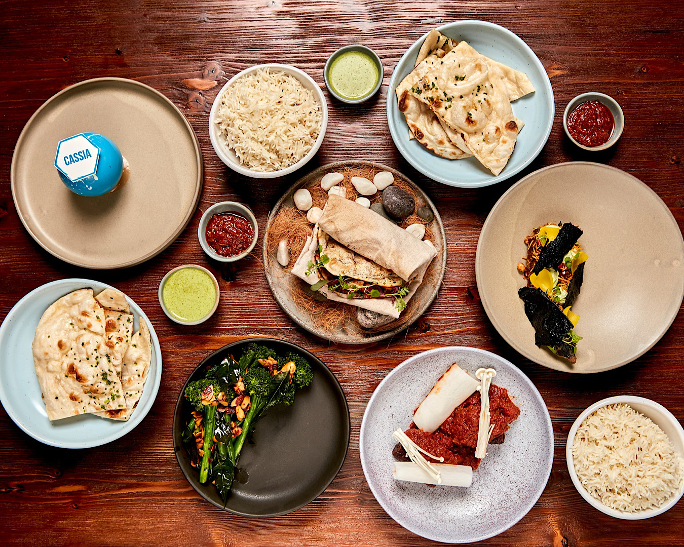 A table full of delicious contemporary Indian food from Cassia, one of the best places to eat at in Auckland this summer. 