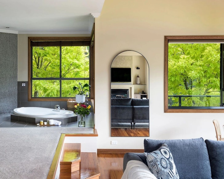 A view of living space and a sunken bath at Cedars Romantic stay NSW