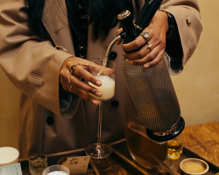 Our writer, Mahi, pours a nitro tea at ChaBliss, one of the best eateries in Parnell. 
