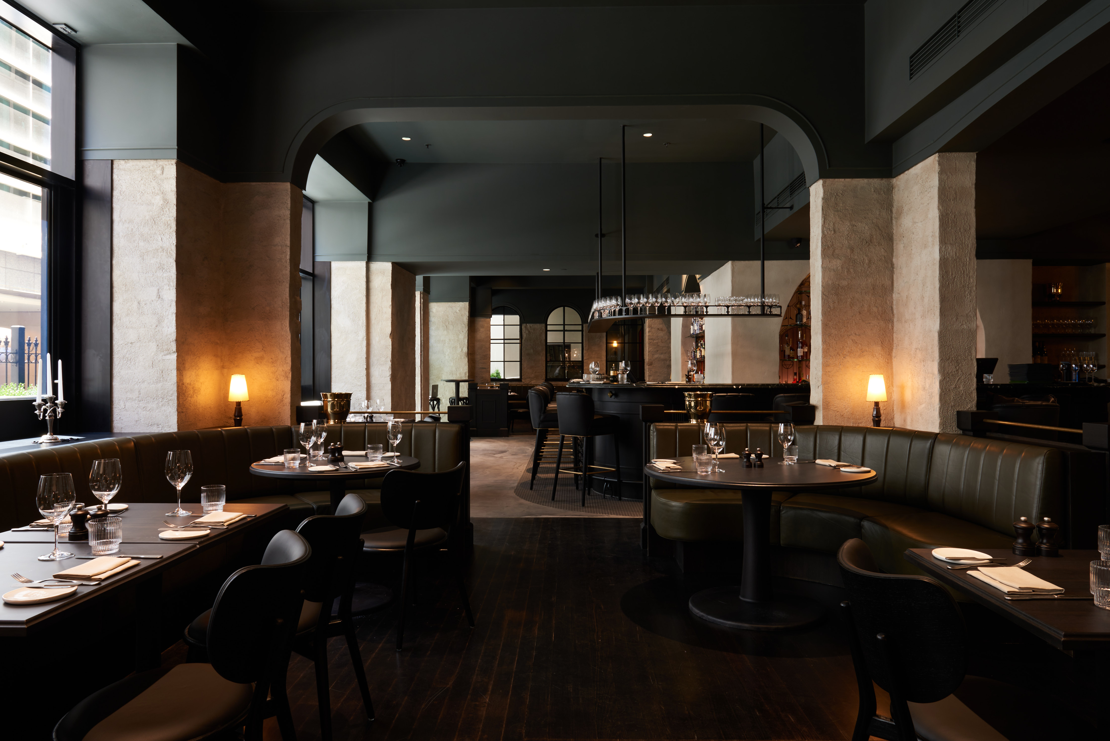 A dimly lit, moody dining room at one fo the best restaurants in Melbourne CBD, Chancery Lane.