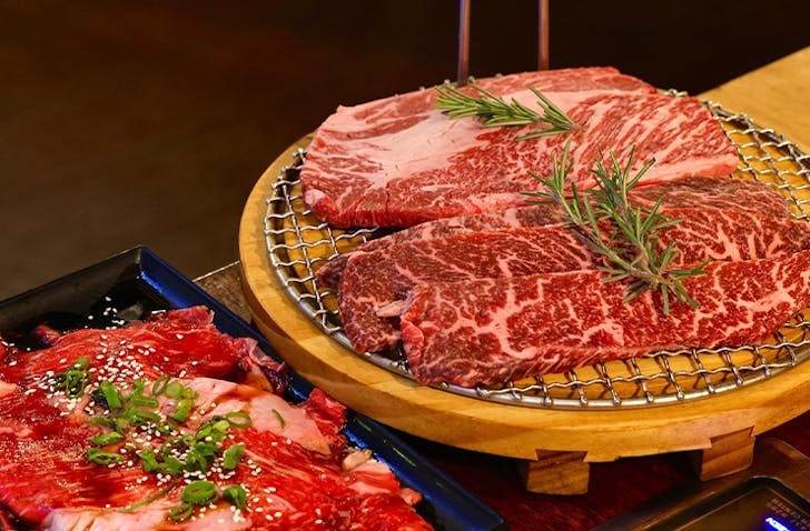 Five slices of premium wagyu sit on top of a Korean BBQ at one of the best Korean restaurants in Melbourne