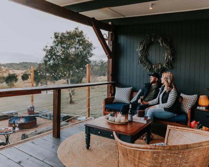 Two guests take in the view at Chatanta Cottage one of the best Queensland romantic getaways