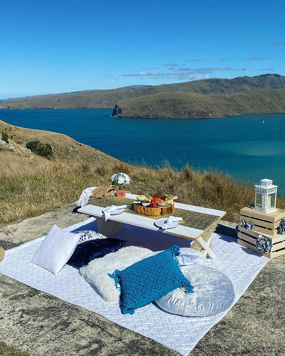 An ideal picnic set up at Godley Head by Christchurch Luxury Picnics.