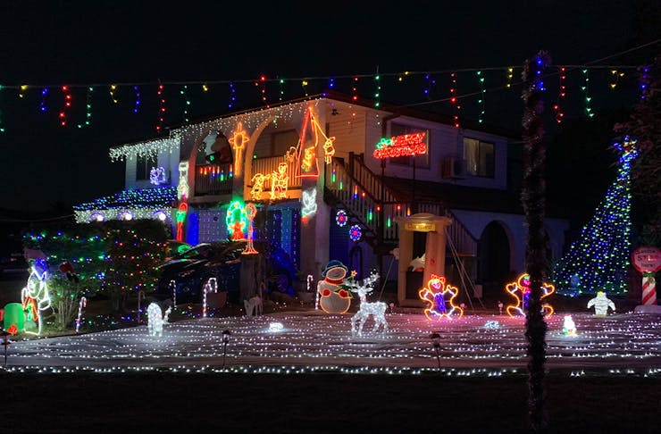 a house lit by Christmas lights