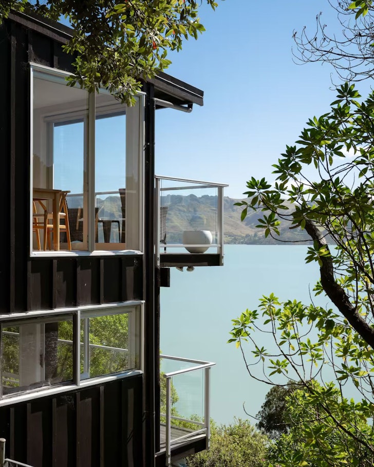 A view of the water behind the house at Church Bay Hideaway one of the best accommodation  options in Christchurch