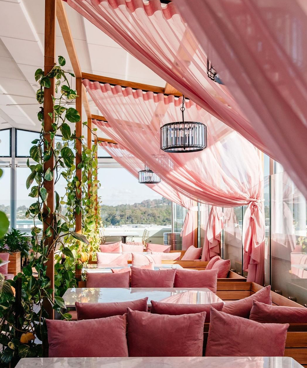 pink rooftop bar with sweeping curtains