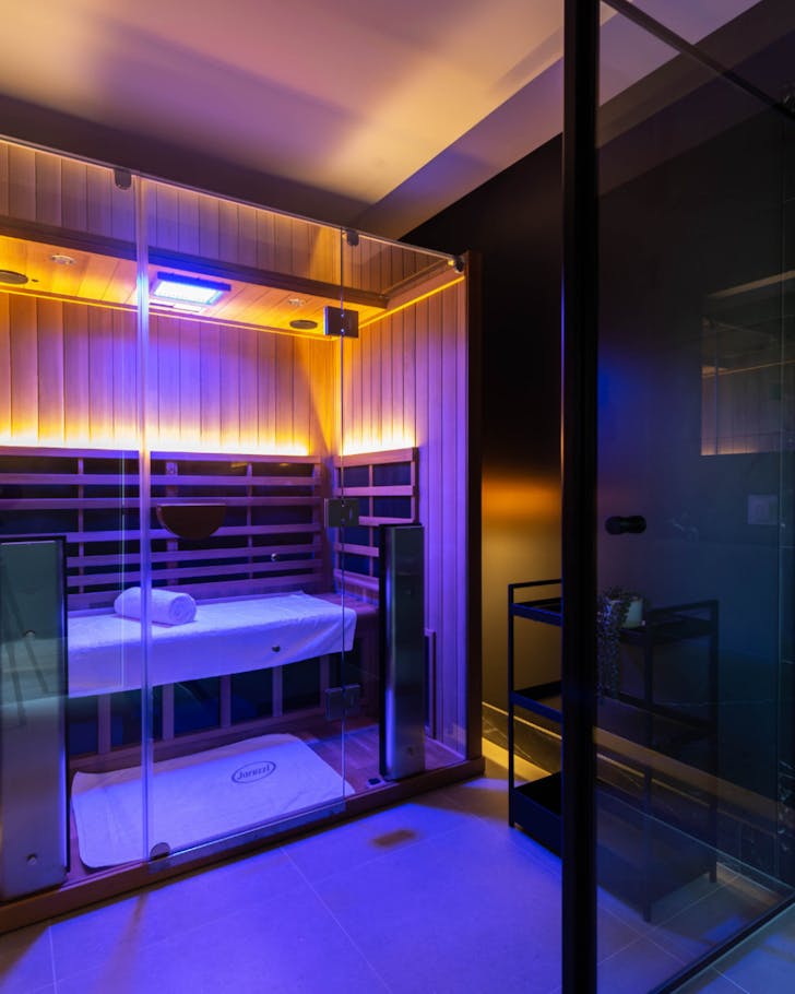 The infrared sauna lit by LED lights at City Cave in Townsville.