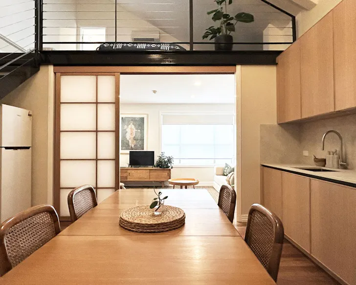 The kitchen and mezzanine at City Loft best Brisbane Airbnbs