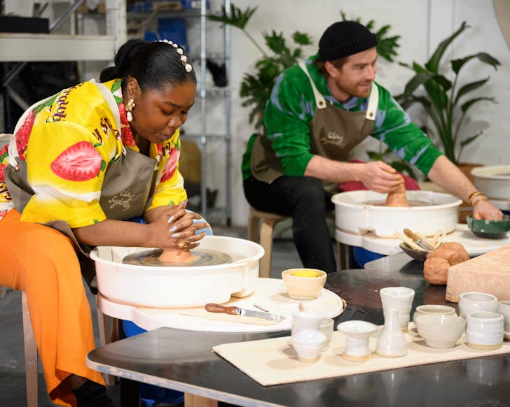Two people in a pottery class