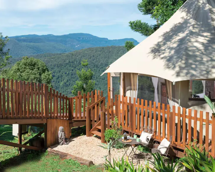 A view of the tent overlooking the hinterland at Clouds Safari Airbnb one of the best romantic getaways in Australia