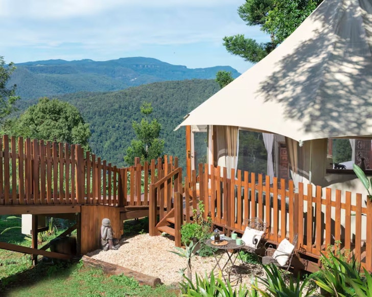 A view of the tent overlooking the hinterland at Clouds Safari Airbnb one of the best romantic getaways in Australia
