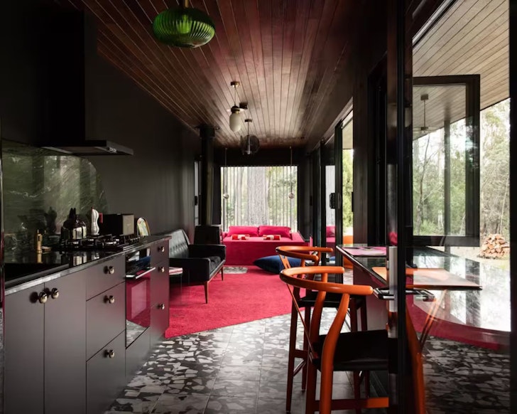 The pink and orange interior of Cntnr 1.0 Airbnb one of the best stays in Tasmania