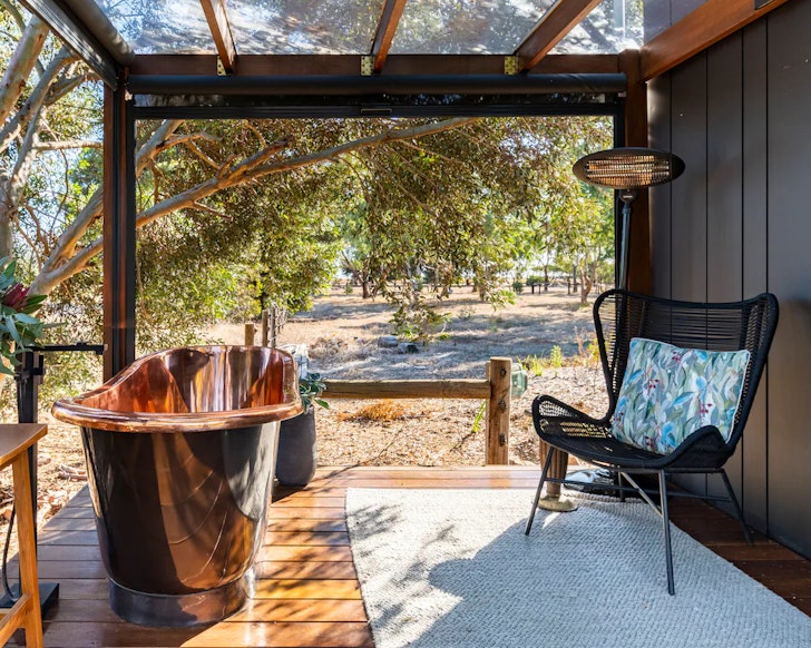 The outdoor copper bath at Coach Light Cabin one of the best Airbnbs near Adelaide