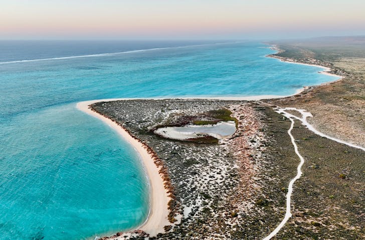 Coastline with clear blue water.
