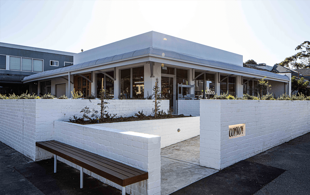 A white brick fence surrounds a sprawling cafe in Moonee Ponds, serving one of the best breakfasts in Melbourne.