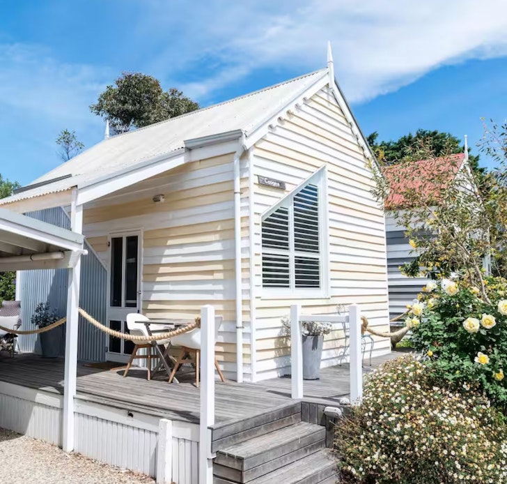 The lemon yellow and white exterior of Coogee Studio Hut one of the best Airbnbs in South Australia