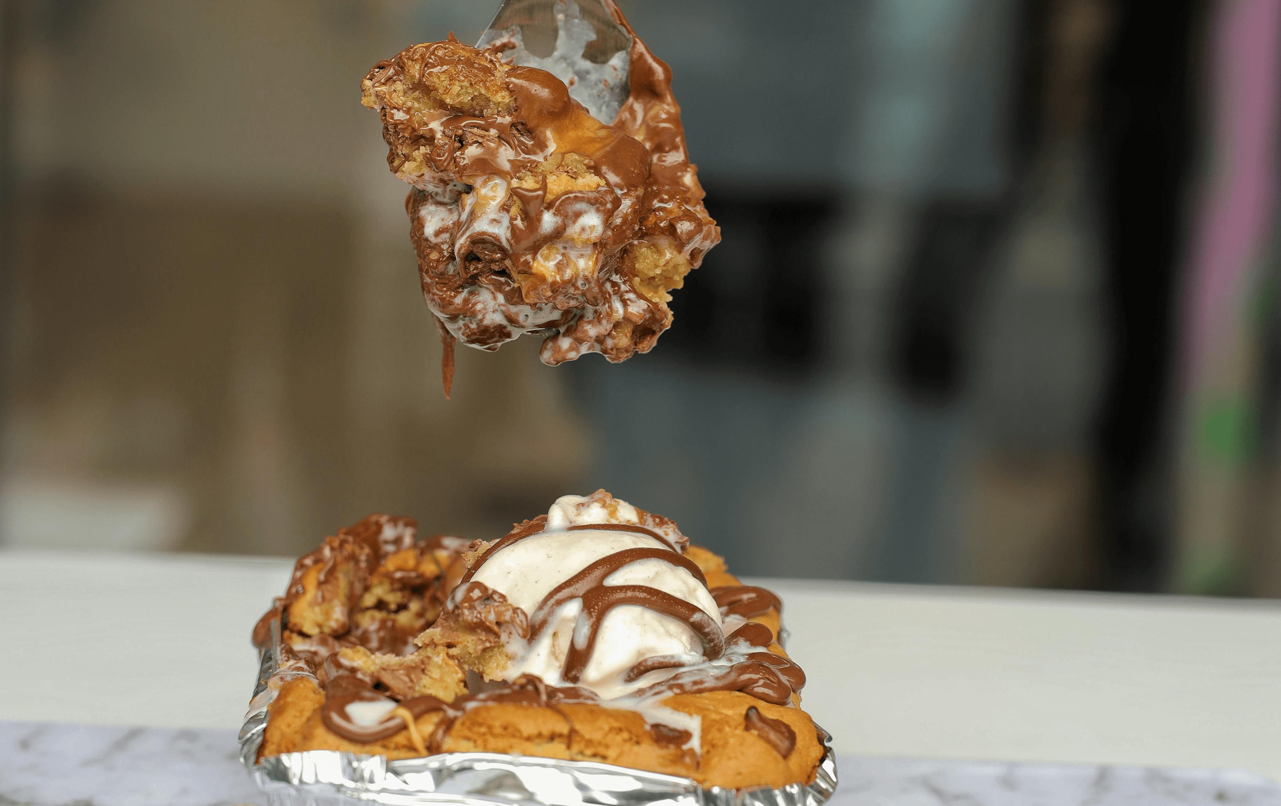 A cookie pie being scooped out. 