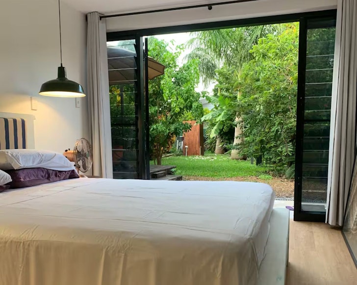 A view out to the garden from the bedroom at Coopers Rest Too one of the best Darwin Airbnbs