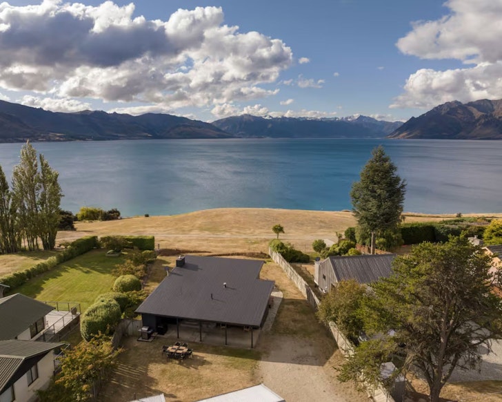 A view of Corner Peak Cottage overlooking the water. It's one of the best accommodation options near Wanaka New Zealand