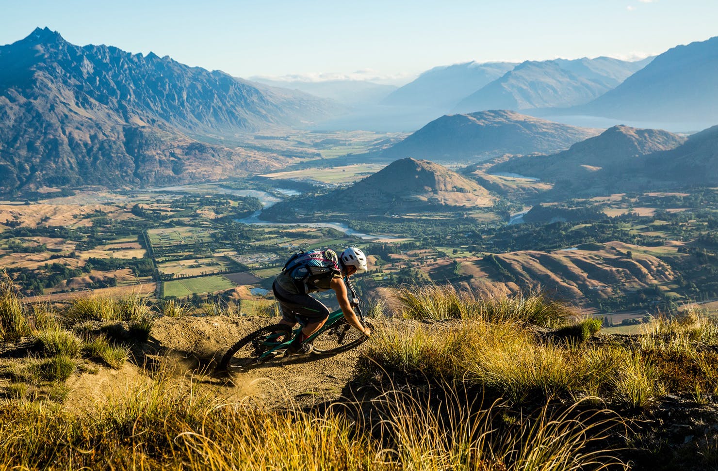 A person mountain biking at coronet peak