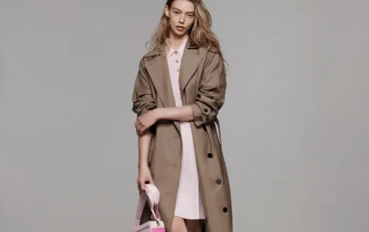 A person in a long trench coat. 