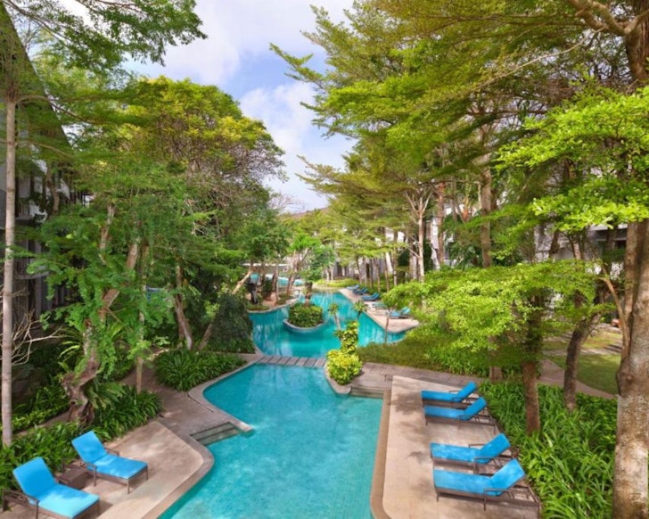 A view of the lagoon-style pool at Courtyard by Marriott one of the best all-inclusive resorts in Bali