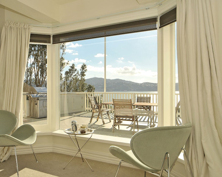 A view out of the window to the private terrace at Crescent Studio one of the best Wellington Airbnbs
