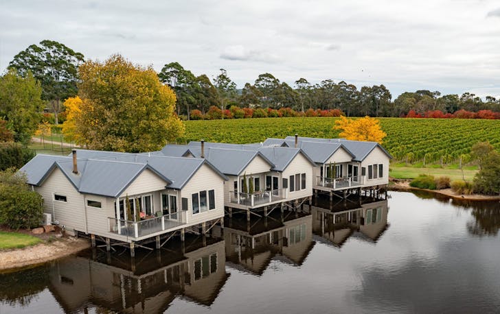 Three small houses overlooking a lake, an option as a winery accommodation Victoria.