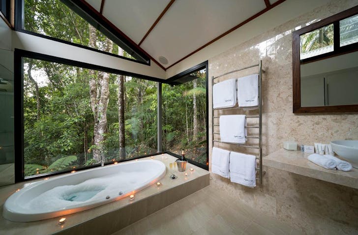 a beautiful bath overlooking rainforest