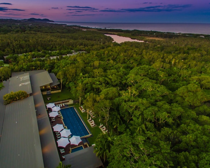 An aerial view of Crystalbrook Byron surrounded by trees one of the best romantic getaways 