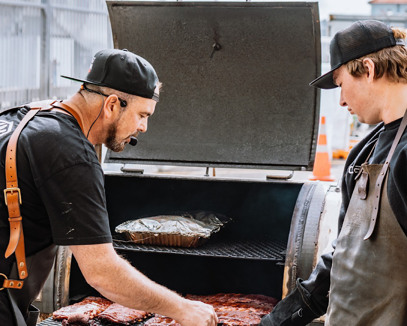 A man demonstrates how to BBQ ribs, low and slow style. 