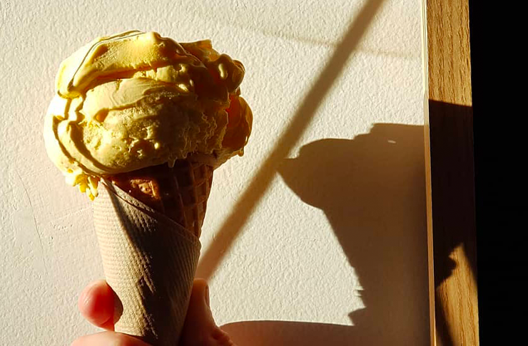 A person holding an ice cream cone, a best ice cream Melbourne option.