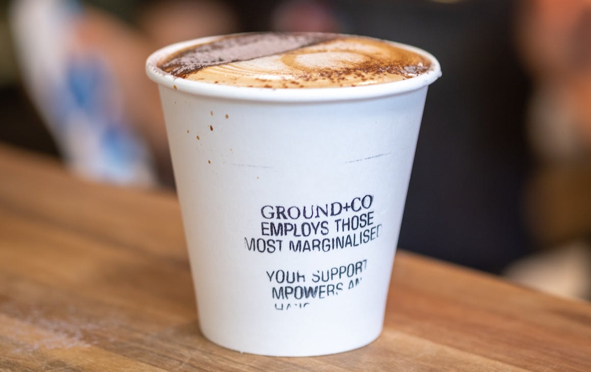 a coffee in a disposable cup
