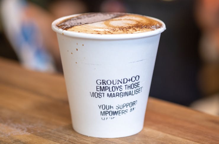 a coffee in a disposable cup