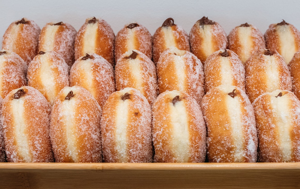 three rows of filled doughnuts